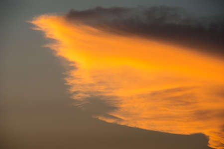 Golden sky over the ocean at dusk.