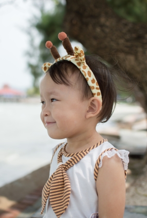 Cute asian girl with hair band portrait.の写真素材