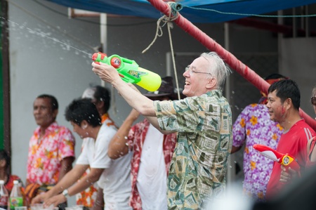 KO SAMUI, THAILAND - APRIL 13: Foreigners and Thai people enjoy splashing water together in songkran festival on April 13, 2013 in Ko Samui island, Thailand.のeditorial素材