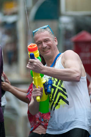KO SAMUI, THAILAND - APRIL 13: Foreigners  enjoy splashing water together in songkran festival on April 13, 2013 in Ko Samui island, Thailand.のeditorial素材
