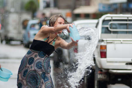 KO SAMUI, THAILAND - APRIL 13: Foreigners and Thai people enjoy splashing water together in songkran festival on April 13, 2013 in Ko Samui island, Thailand.のeditorial素材