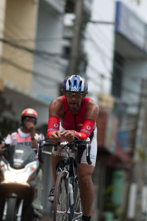 SAMUI, THAILAND - APRIL 21 2013: Samui triathlon 2013 event. Surat Thitinanthaphan in action during the triathlon on Sunday 21 April 2013 in Ko Samui island, Suratthani, Thailand.のeditorial素材