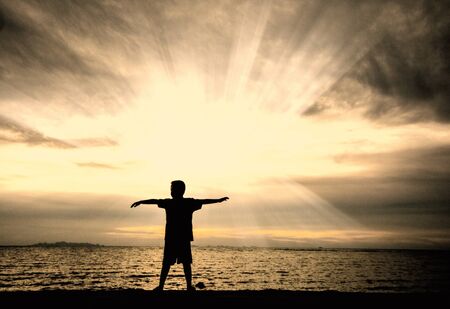 silhouette of happy family at the beach.の写真素材