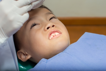 Asain kid at the dentist clinic.の写真素材