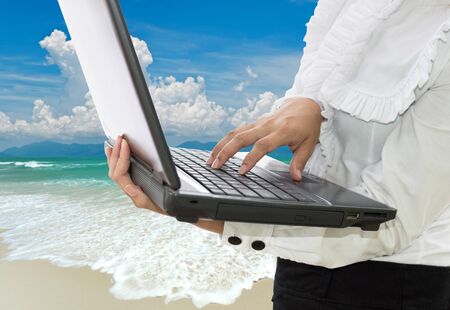 business woman in white shirt using computer notebook.の写真素材