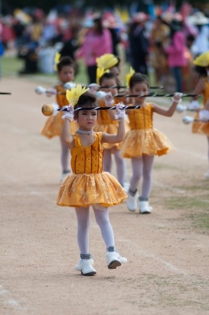 kO SAMUI,SURAT THANI - JULY 18 :Unidentified Thai students 4 - 6 years old in ceremony uniform during sport parade on July 18, 2012 in ko samui, Surat Thani, Thailand.のeditorial素材