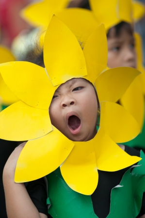 KO SAMUI,SURAT THANI - JULY 18 : Unidentified Thai students 4 - 7 years old in ceremony uniform during sport parade on July 18, 2012 in ko samui, Surat Thani, Thailand.のeditorial素材