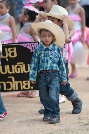 KO SAMUI,SURAT THANI - JULY 18 : Unidentified Thai students 4 - 7 years old in ceremony uniform during sport parade on July 18, 2012 in ko samui, Surat Thani, Thailand.のeditorial素材