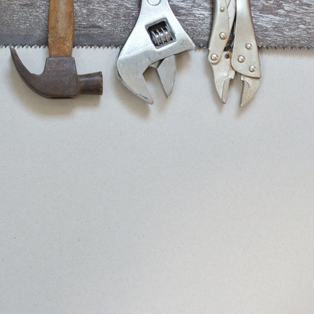 Work tools on gray recycled paper background.