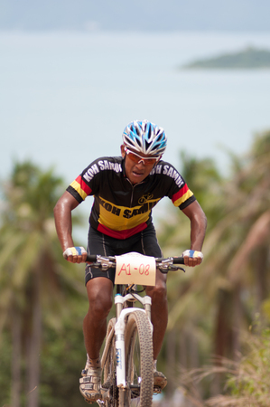 KO SAMUI, THAILAND - SEPTEMBER 8: Athlete in action during Samui MTB 2013 at ko samui city on September 8,2013 in Ko Samui island, Thailand. The third of mountain bike race in ko samui city suratthaini province Thailand.のeditorial素材