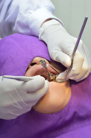 Woman patient treatment in dental clinic.