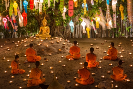 CHIANG MAI, THAILAND - DEC 31: New year festival, Buddhist monk fire candles to the Buddha on Dec 31, 2013 in Phan Tao Temple, Chiangmai, Thailand.のeditorial素材