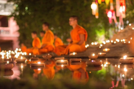CHIANG MAI, THAILAND - DEC 31: New year festival, Buddhist monk fire candles to the Buddha on Dec 31, 2013 in Phan Tao Temple, Chiangmai, Thailand.のeditorial素材
