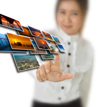 Business woman pointing at business concept icon.の写真素材