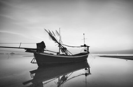 Lonely motor boat on the beach, ko samui, thailand.の写真素材