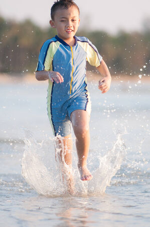 Cute asian kid with swimming suit activity.の写真素材