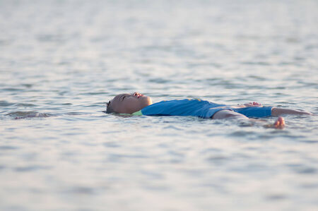 Cute asian kid with swimming suit activity.の写真素材
