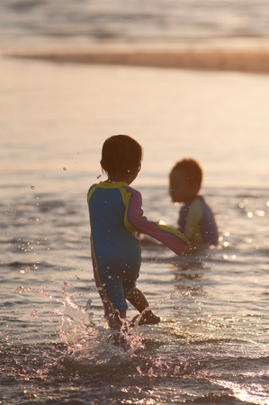 Cute asian kid with swimming suit activity.の写真素材