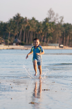 Cute asian kid with swimming suit activity.の写真素材