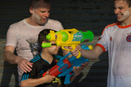 KO SAMUI, THAILAND - APRIL 13: Foreigners and Thai people enjoy splashing water together in songkran festival on April 13, 2014 in Ko Samui island, Thailand.のeditorial素材