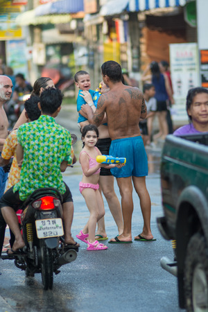 KO SAMUI, THAILAND - APRIL 13: Foreigners and Thai people enjoy splashing water together in songkran festival on April 13, 2014 in Ko Samui island, Thailand.のeditorial素材