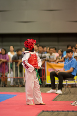 SURTTHANI, THAILAND - JULY 12: Unidentified Thai students 4 - 17 years old in action at suratthani taekwondo championship 2014 on July 12, 2014 in Suratthani, Thailand.のeditorial素材