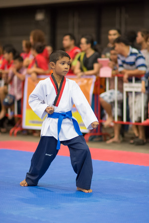 SURTTHANI, THAILAND - JULY 12: Unidentified Thai students 4 - 17 years old in action at suratthani taekwondo championship 2014 on July 12, 2014 in Suratthani, Thailand.のeditorial素材