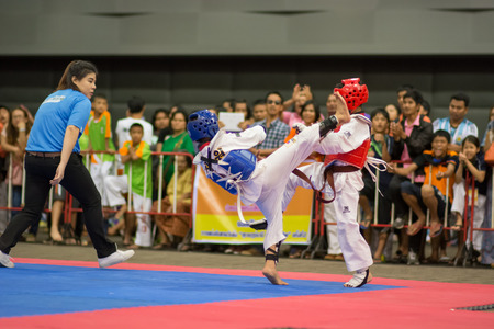 SURTTHANI, THAILAND - JULY 12: Unidentified Thai students 4 - 17 years old in action at suratthani taekwondo championship 2014 on July 12, 2014 in Suratthani, Thailand.のeditorial素材