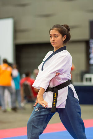 SURTTHANI, THAILAND - JULY 12: Unidentified Thai students 4 - 17 years old in action at suratthani taekwondo championship 2014 on July 12, 2014 in Suratthani, Thailand.のeditorial素材