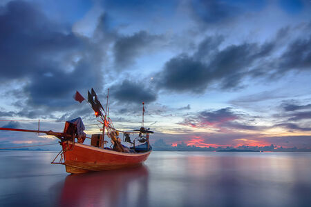 Classic Thai fisherman boat at sunset.の写真素材