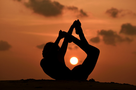 High quality, high resolution, professional yoga woman silhouette at sunset.の写真素材