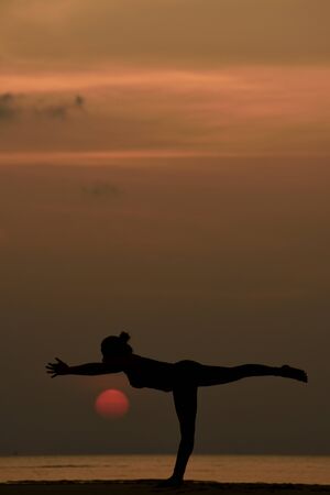 High quality, high resolution, professional yoga woman silhouette at sunset.の写真素材