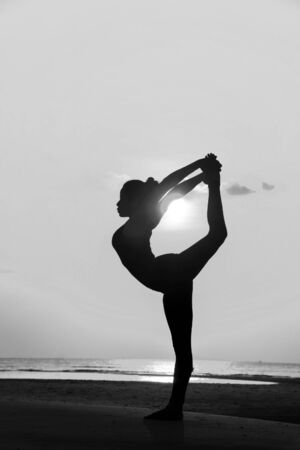 High quality, high resolution, professional yoga woman silhouette at sunset.の写真素材