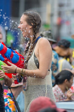 CHIANGMAI, THAILAND - APRIL 14: Foreigners and Thai people enjoy splashing water together in songkran festival on April 14, 2015in Chiangmai, Thailand.のeditorial素材