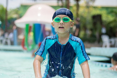 Asain kid in swimming pool.の写真素材