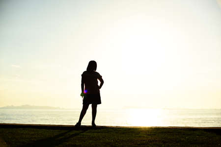 Silhouette life and activity on the beach at dusk.の写真素材