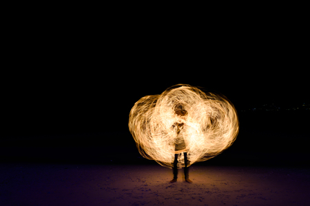 Fire perfomance on the beach.の写真素材