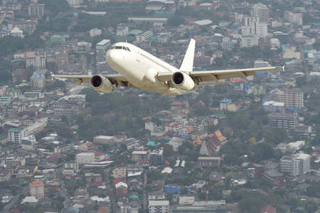 Single white airplane with nature background.