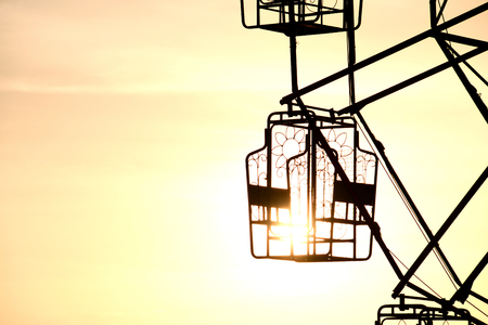 Thai rural ferris wheel silhouette at sunset.の写真素材