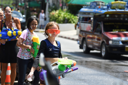 KO SAMUI, THAILAND - APRIL 13: Foreigners and Thai people enjoy splashing water together in songkran festival on April 13, 2018 in Ko Samui island, Thailand.のeditorial素材