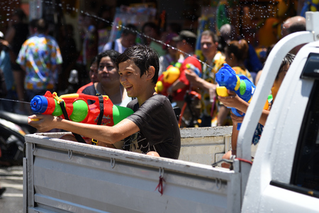 KO SAMUI, THAILAND - APRIL 13: Foreigners and Thai people enjoy splashing water together in songkran festival on April 13, 2018 in Ko Samui island, Thailand.のeditorial素材
