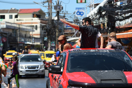 KO SAMUI, THAILAND - APRIL 13: Foreigners and Thai people enjoy splashing water together in songkran festival on April 13, 2018 in Ko Samui island, Thailand.のeditorial素材