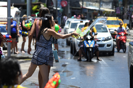 KO SAMUI, THAILAND - APRIL 13: Foreigners and Thai people enjoy splashing water together in songkran festival on April 13, 2018 in Ko Samui island, Thailand.のeditorial素材