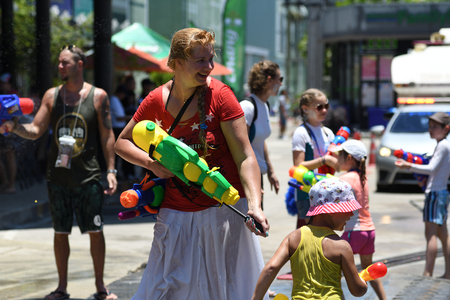 KO SAMUI, THAILAND - APRIL 13: Foreigners and Thai people enjoy splashing water together in songkran festival on April 13, 2018 in Ko Samui island, Thailand.のeditorial素材