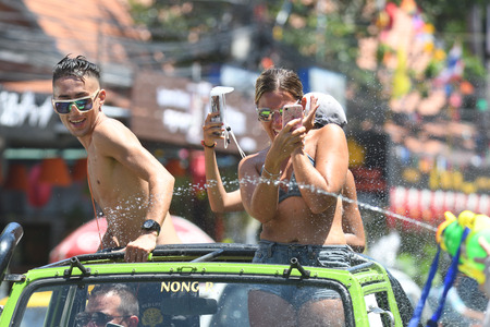 KO SAMUI, THAILAND - APRIL 13: Foreigners and Thai people enjoy splashing water together in songkran festival on April 13, 2018 in Ko Samui island, Thailand.のeditorial素材