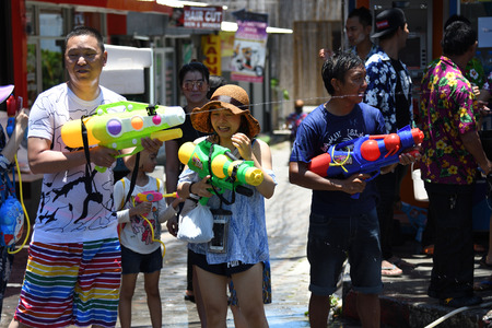 KO SAMUI, THAILAND - APRIL 13: Foreigners and Thai people enjoy splashing water together in songkran festival on April 13, 2018 in Ko Samui island, Thailand.のeditorial素材