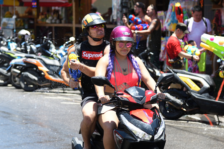 KO SAMUI, THAILAND - APRIL 13: Foreigners and Thai people enjoy splashing water together in songkran festival on April 13, 2018 in Ko Samui island, Thailand.のeditorial素材