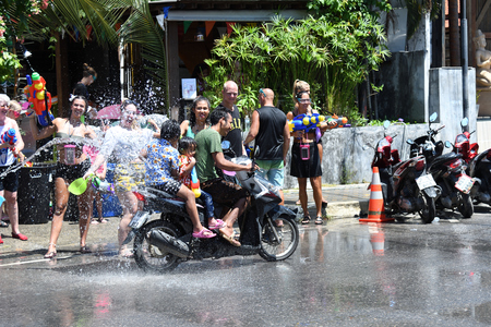KO SAMUI, THAILAND - APRIL 13: Foreigners and Thai people enjoy splashing water together in songkran festival on April 13, 2018 in Ko Samui island, Thailand.のeditorial素材