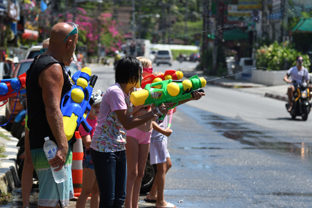 KO SAMUI, THAILAND - APRIL 13: Foreigners and Thai people enjoy splashing water together in songkran festival on April 13, 2018 in Ko Samui island, Thailand.のeditorial素材