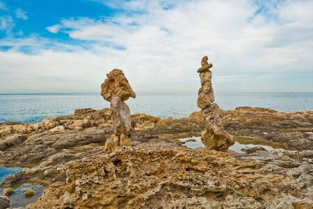 Pyramids from stones on seacoastの写真素材